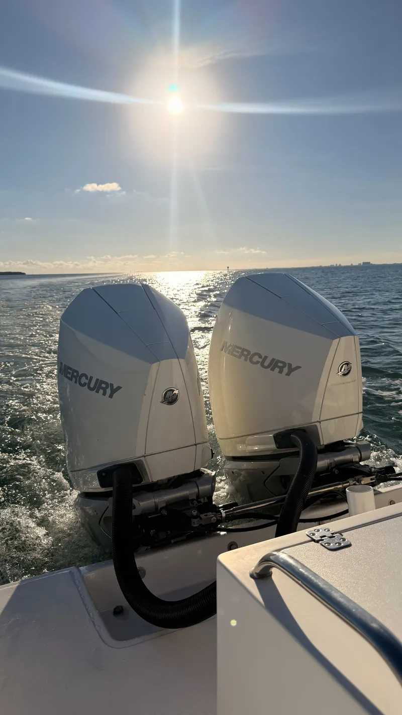 Slide: The Image of 2006 Dakota 36 Cuddy with twin Mercury engines on water. - 8