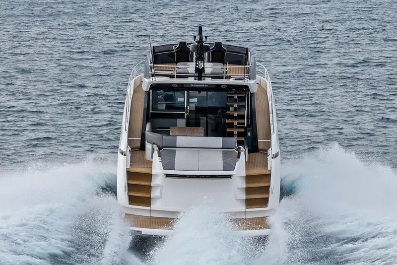 Slide: The Image of 2022 Sunseeker 65 Sport Yacht cruising on open water, rear view. - 10