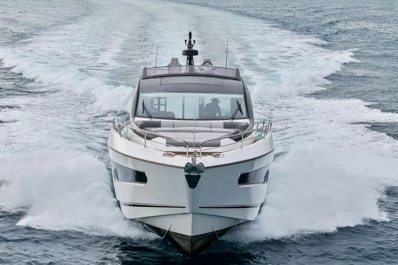 Slide: The Image of 2022 Sunseeker 65 Sport Yacht cruising on open water, front view. - 15