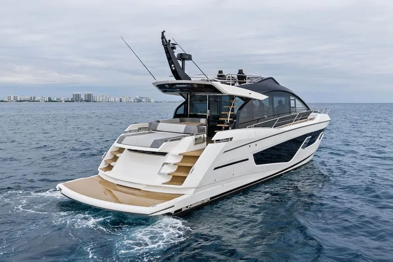 Slide: The Image of 2022 Sunseeker 65 Sport Yacht cruising on open water, showcasing sleek design and luxury features. - 19