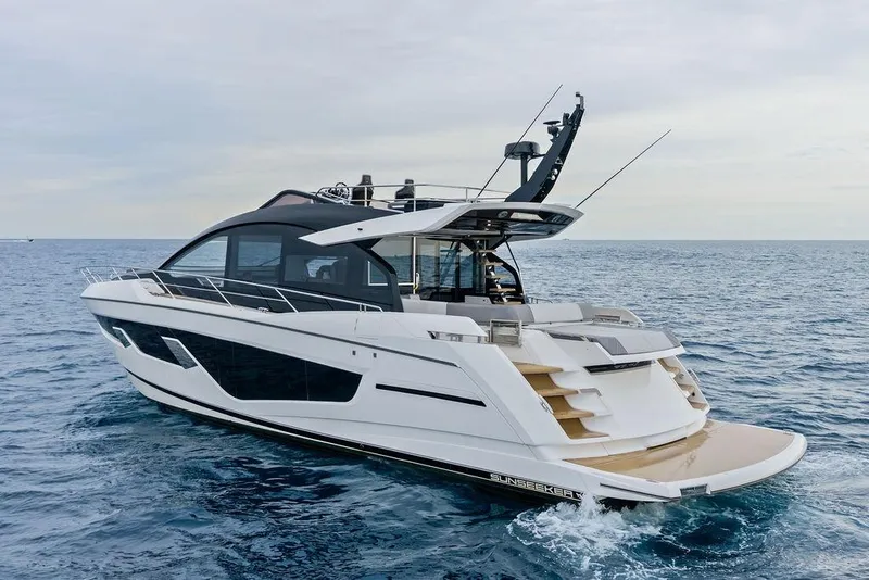 Slide: The Image of 2022 Sunseeker 65 Sport Yacht cruising on open sea, showcasing sleek design and luxury features. - 21
