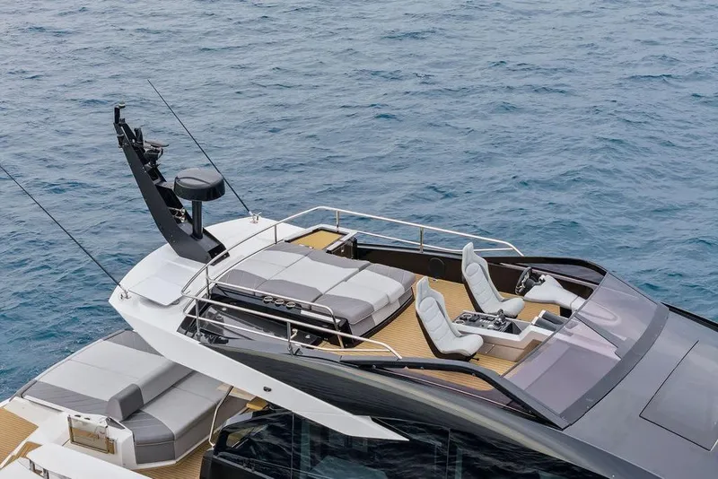 Slide: The Image of 2022 Sunseeker 65 Sport Yacht with sleek design and luxurious seating on open water. - 24