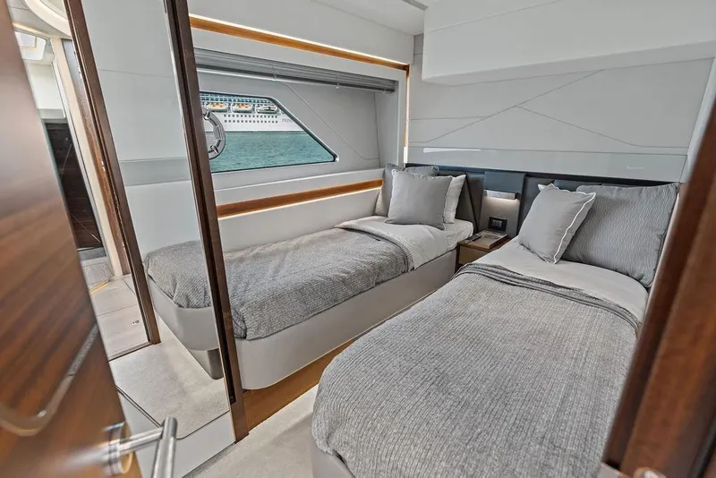 Slide: The Image of Luxurious twin bedroom in 2022 Sunseeker 65 Sport Yacht with ocean view. - 30
