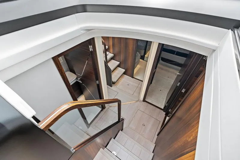 Slide: The Image of Interior view of 2022 Sunseeker 65 Sport Yacht, featuring elegant wood finishes and modern design. - 34