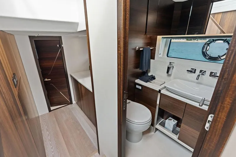 Slide: The Image of Luxurious bathroom interior of 2022 Sunseeker 65 Sport Yacht with modern fixtures and wood accents. - 35