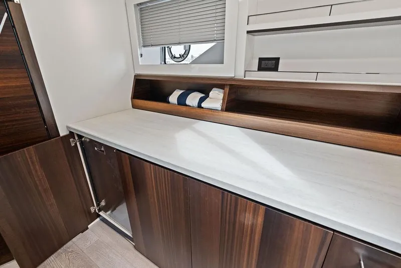 Slide: The Image of Interior of 2022 Sunseeker 65 Sport Yacht with sleek wooden cabinetry and modern design. - 36