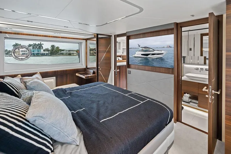 Slide: The Image of Luxurious bedroom interior of 2022 Sunseeker 65 Sport Yacht with elegant wood finishes. - 38
