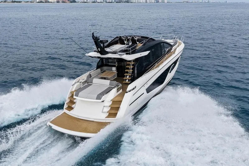 Slide: The Image of 2022 Sunseeker 65 Sport Yacht cruising on open water, showcasing sleek design and luxury. - 4