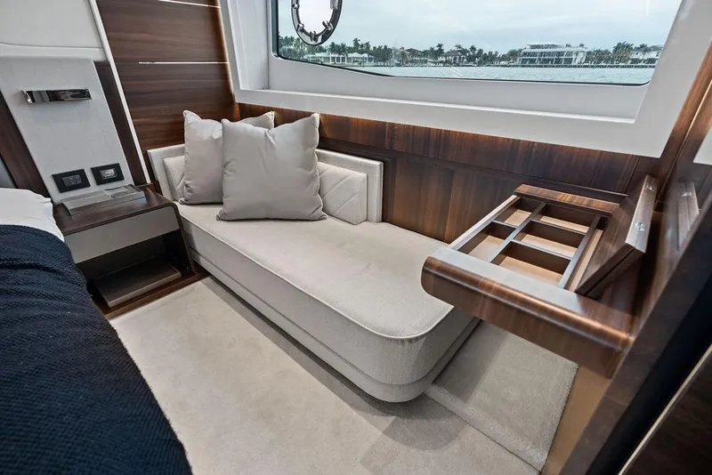 Slide: The Image of Luxurious interior of 2022 Sunseeker 65 Sport Yacht with elegant seating and wood accents. - 40