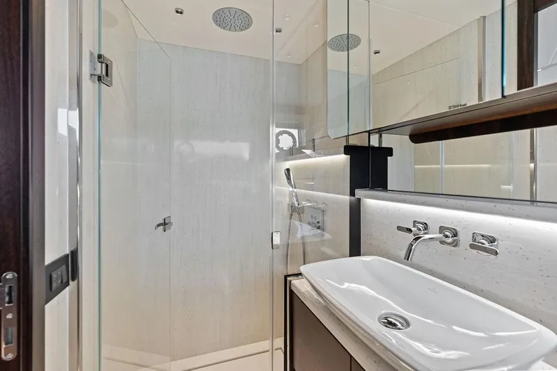 Slide: The Image of Luxurious bathroom in 2022 Sunseeker 65 Sport Yacht with modern fixtures and glass shower. - 42