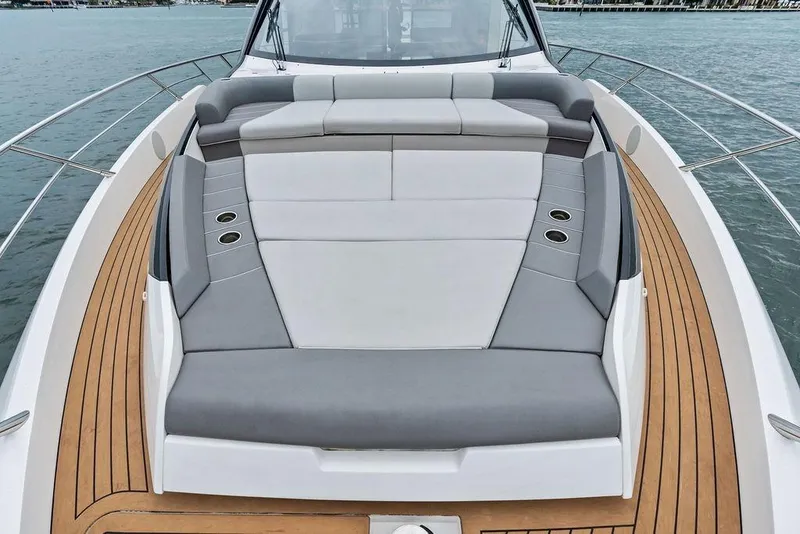 Slide: The Image of 2022 Sunseeker 65 Sport Yacht deck with luxurious seating and teak flooring. - 48