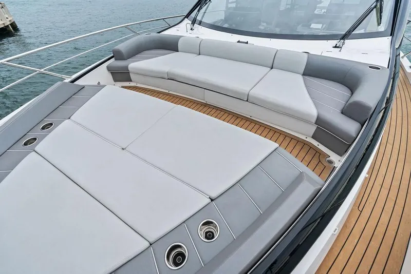 Slide: The Image of Luxurious seating area on 2022 Sunseeker 65 Sport Yacht with sleek design and teak decking. - 49