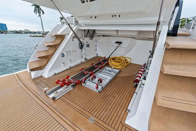 Slide: The Image of 2022 Sunseeker 65 Sport Yacht storage area with equipment and teak flooring. - 55