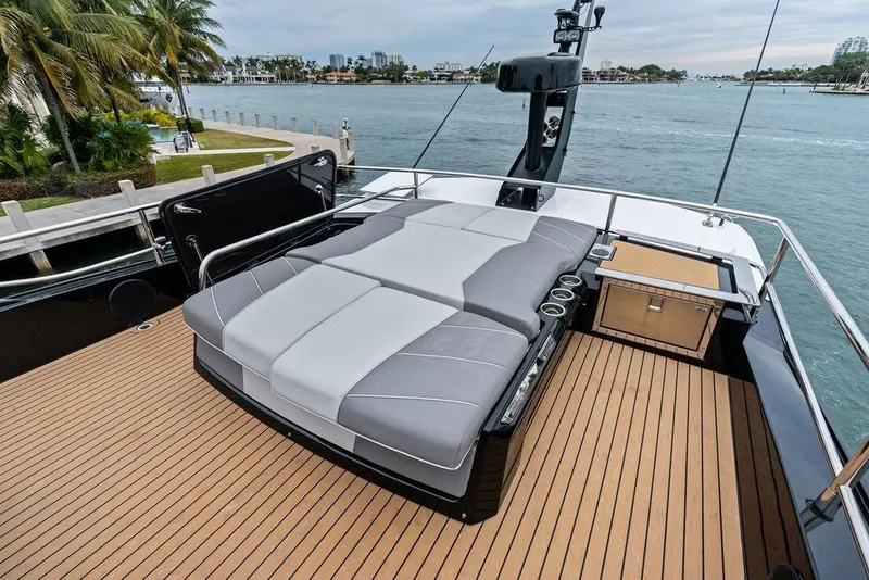 Slide: The Image of 2022 Sunseeker 65 Sport Yacht deck with luxurious seating and ocean view. - 62