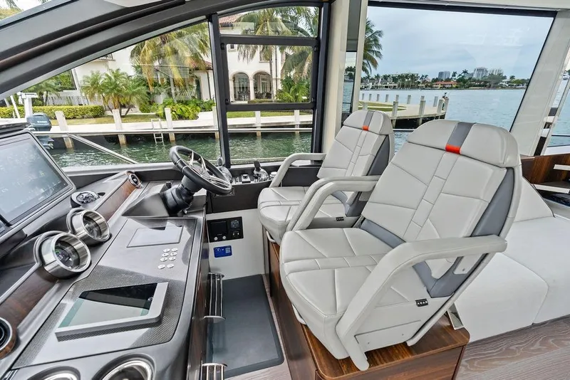 Slide: The Image of Luxurious interior of 2022 Sunseeker 65 Sport Yacht with modern helm and seating. - 66