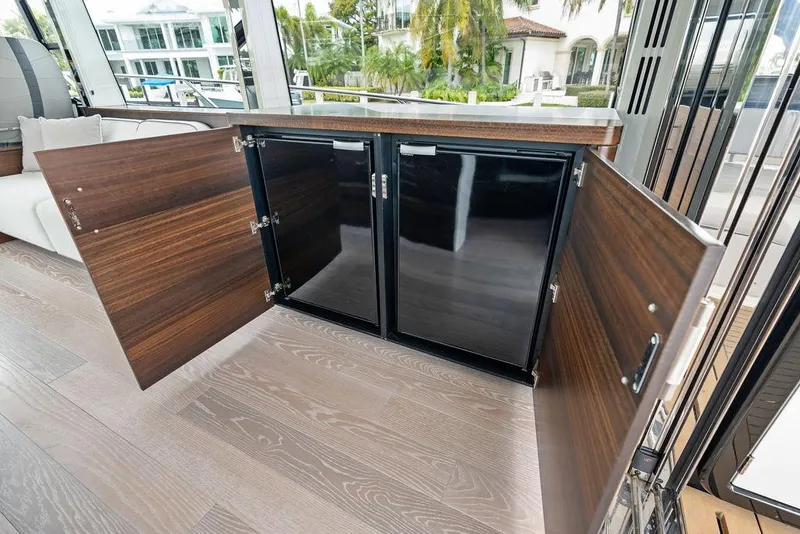 Slide: The Image of Open cabinet on 2022 Sunseeker 65 Sport Yacht, showcasing sleek interior design and modern amenities. - 71
