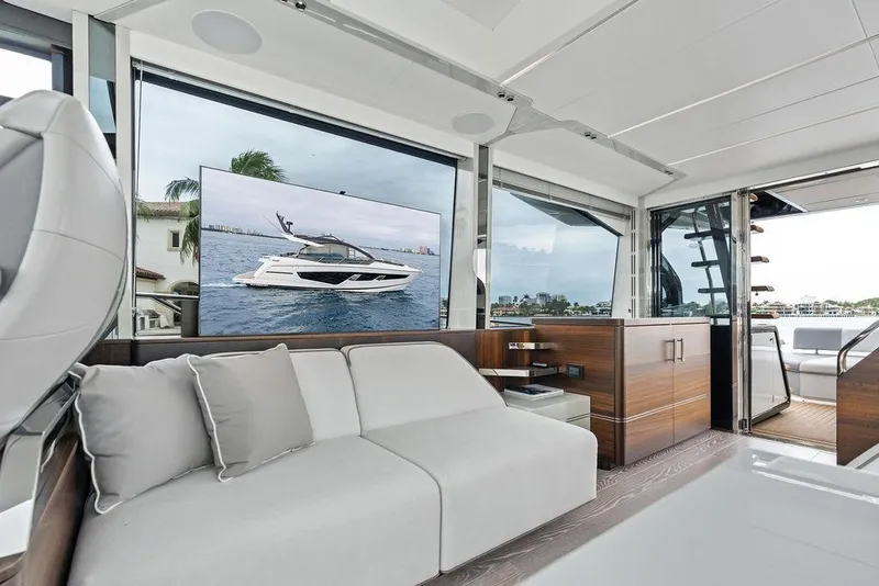Slide: The Image of Luxurious interior of 2022 Sunseeker 65 Sport Yacht with modern design and large windows. - 75