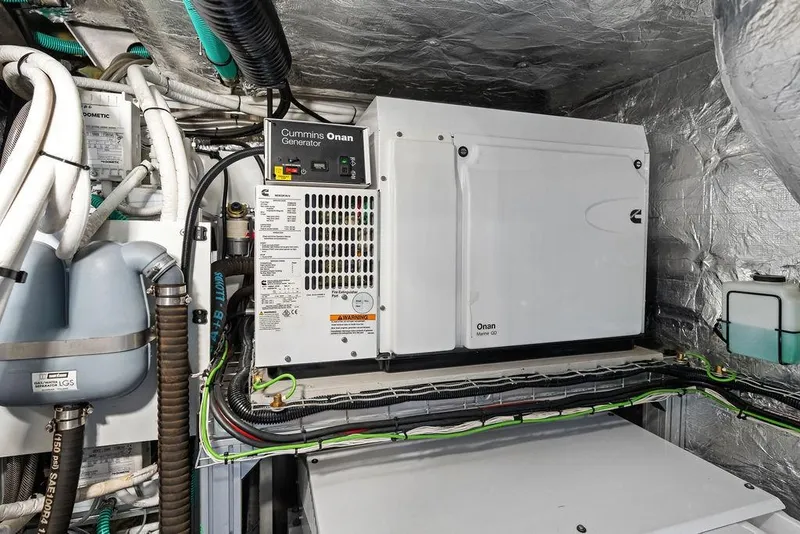 Slide: The Image of Engine room of 2022 Sunseeker 65 Sport Yacht with Cummins Onan generator. - 80