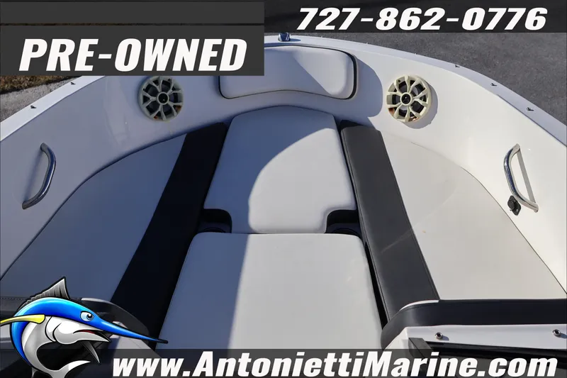Slide: The Image of Pre-owned 2022 Bayliner VR4 Bowrider OB boat interior with seating and speakers. - 12
