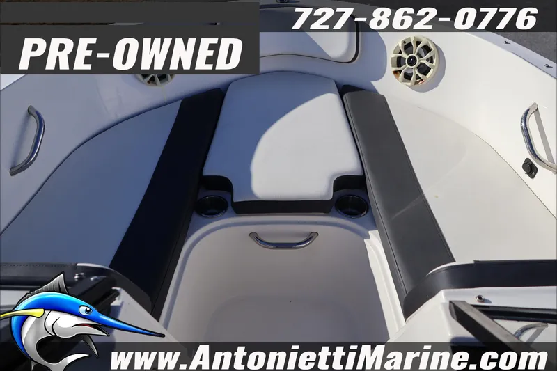 Slide: The Image of Pre-owned 2022 Bayliner VR4 Bowrider OB interior with seating and cup holders. - 14