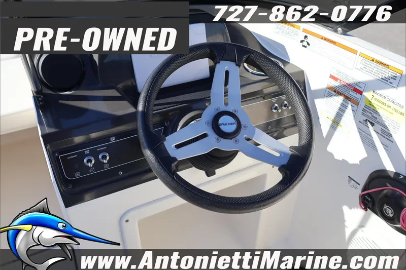 Slide: The Image of Pre-owned 2022 Bayliner VR4 Bowrider OB steering wheel and dashboard details. - 16