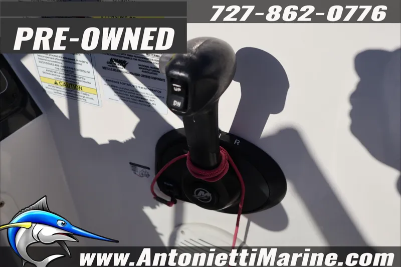 Slide: The Image of Pre-owned 2022 Bayliner VR4 Bowrider OB throttle control with contact details and logo. - 17