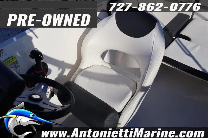 Slide: The Image of Pre-owned 2022 Bayliner VR4 Bowrider OB boat interior with steering wheel and seat. - 24