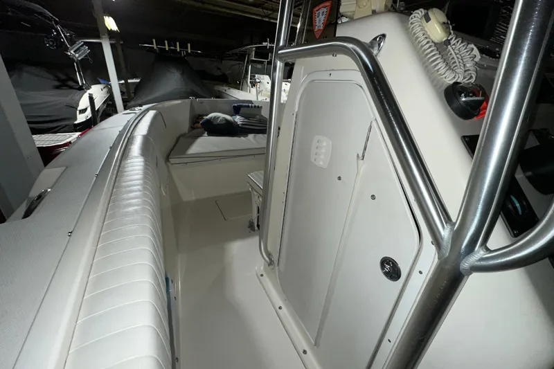 Slide: The Image of 2006 Clearwater 2508 boat interior with seating and control panel. - 8