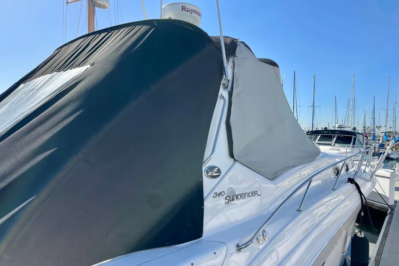 Slide: The Image of 2007 Sea Ray 340 Sundancer yacht docked at marina under clear blue sky. - 11