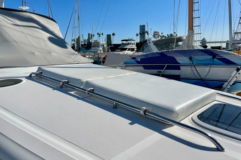 Slide: The Image of 2007 Sea Ray 340 Sundancer yacht deck with sunpad, docked in marina. - 13