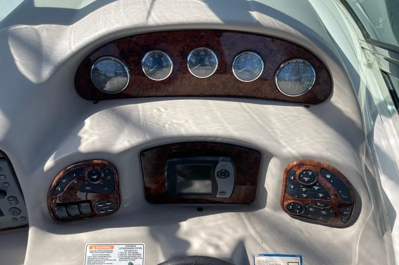 Slide: The Image of Dashboard of a 2007 Sea Ray 340 Sundancer boat with gauges and controls. - 31
