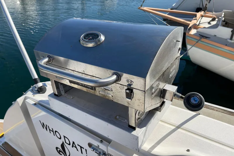 Slide: The Image of Stainless steel grill on 2007 Sea Ray 340 Sundancer boat, docked by the water. - 33