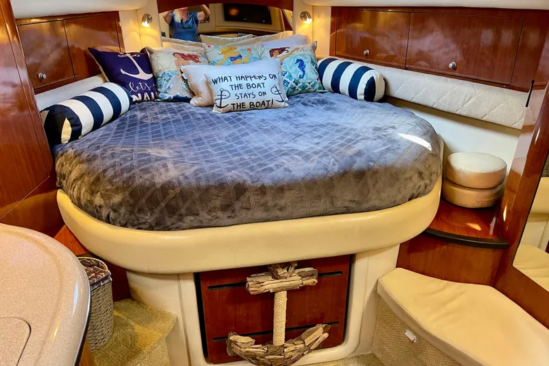 Slide: The Image of Luxurious 2007 Sea Ray 340 Sundancer cabin with cozy bed and nautical decor. - 38