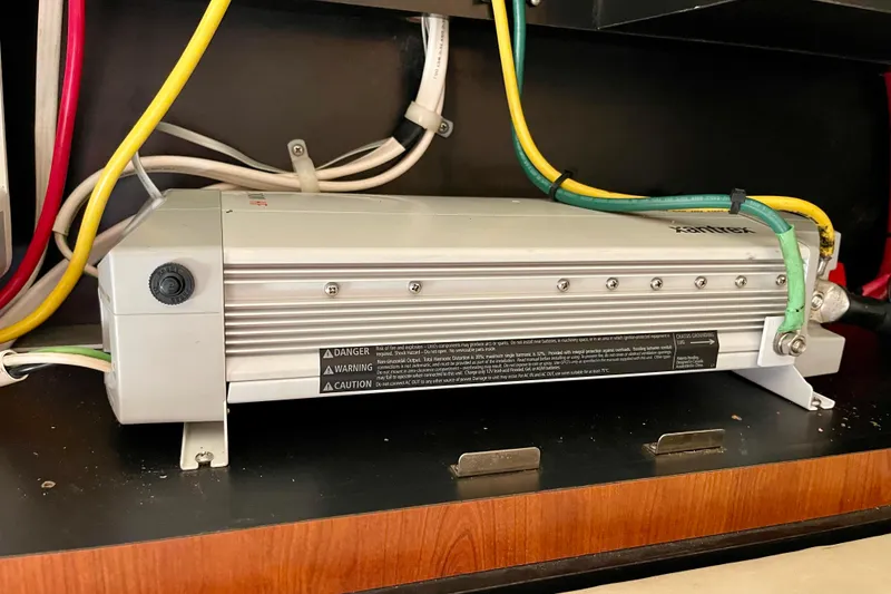 Slide: The Image of Electrical system inside 2007 Sea Ray 340 Sundancer boat, featuring wiring and components. - 46