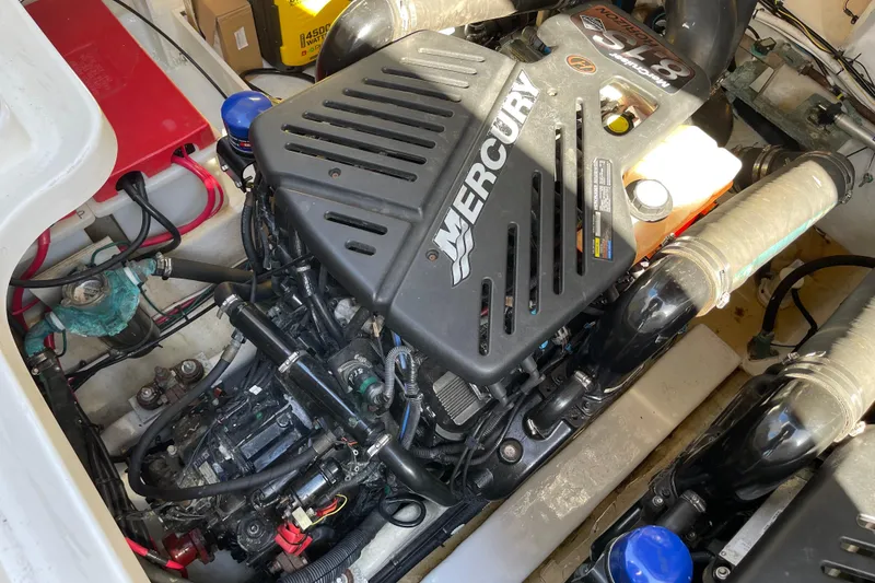 Slide: The Image of Engine compartment of a 2007 Sea Ray 340 Sundancer with Mercury engine components. - 50