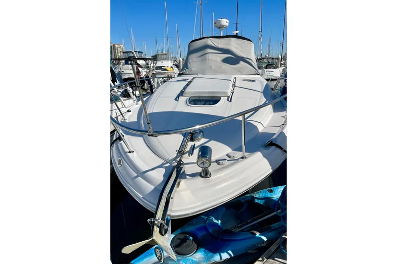 Slide: The Image of 2007 Sea Ray 340 Sundancer yacht docked in marina, front view with clear blue sky. - 7