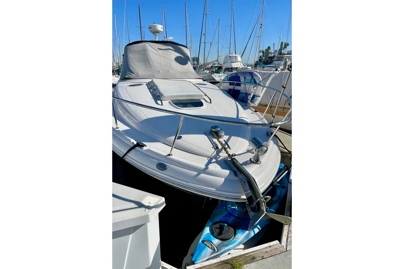 Slide: The Image of 2007 Sea Ray 340 Sundancer yacht docked in marina, surrounded by sailboats. - 8