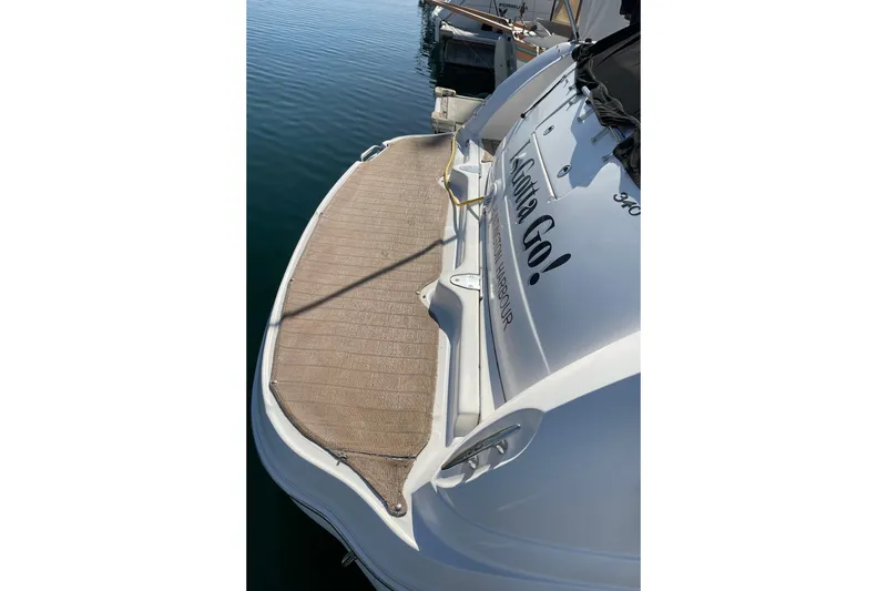 Slide: The Image of 2007 Sea Ray 340 Sundancer boat docked with swim platform visible. - 9