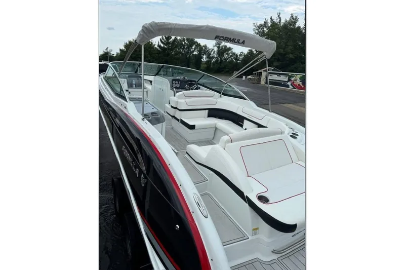 Slide: The Image of 2014 Formula 310 Bowrider boat with sleek design and spacious seating. - 3