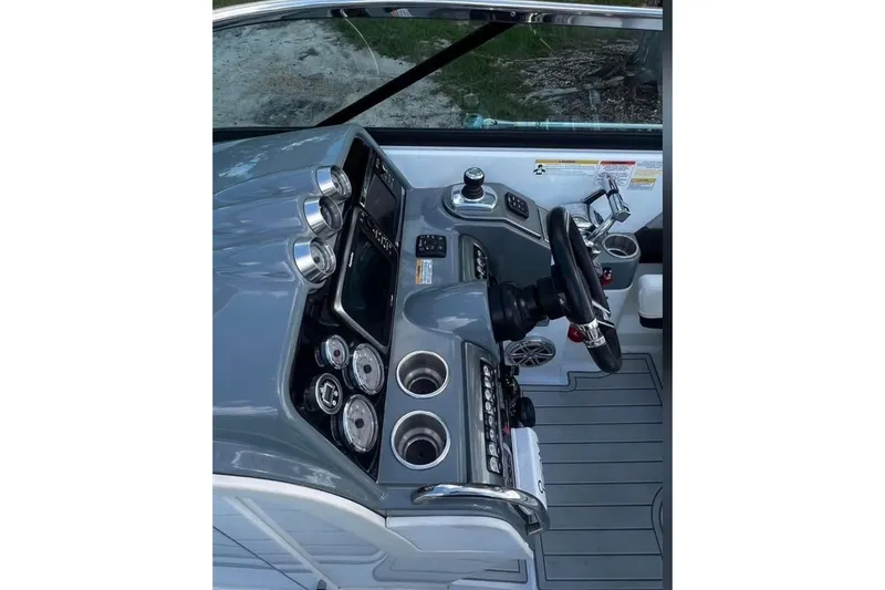 Slide: The Image of 2014 Formula 310 Bowrider dashboard with steering wheel and control panel. - 7