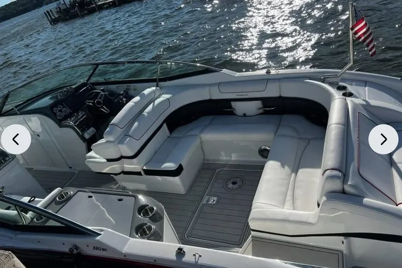 Slide: The Image of 2014 Formula 310 Bowrider with luxurious seating, on a sunny day by the water. - 9