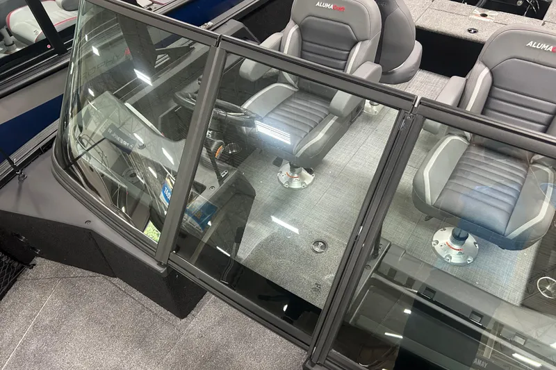 Slide: The Image of 2026 Alumacraft Competitor 185X Sport interior with sleek seating and modern dashboard design. - 16