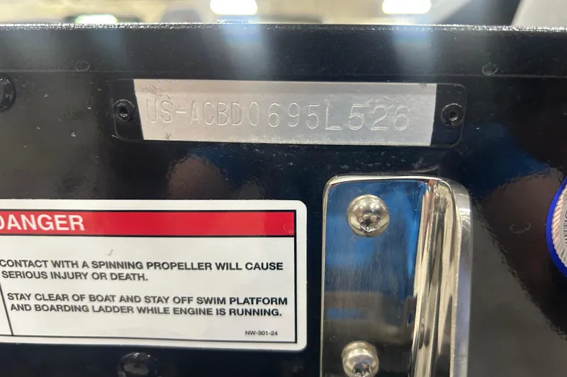 Slide: The Image of 2026 Alumacraft Competitor 185X Sport boat warning label and serial number plate. - 17