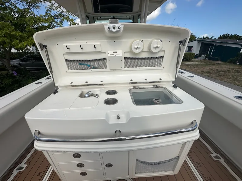 Slide: The Image of Boston Whaler 320 Outrage 2013, fishing station with sink and storage. - 27