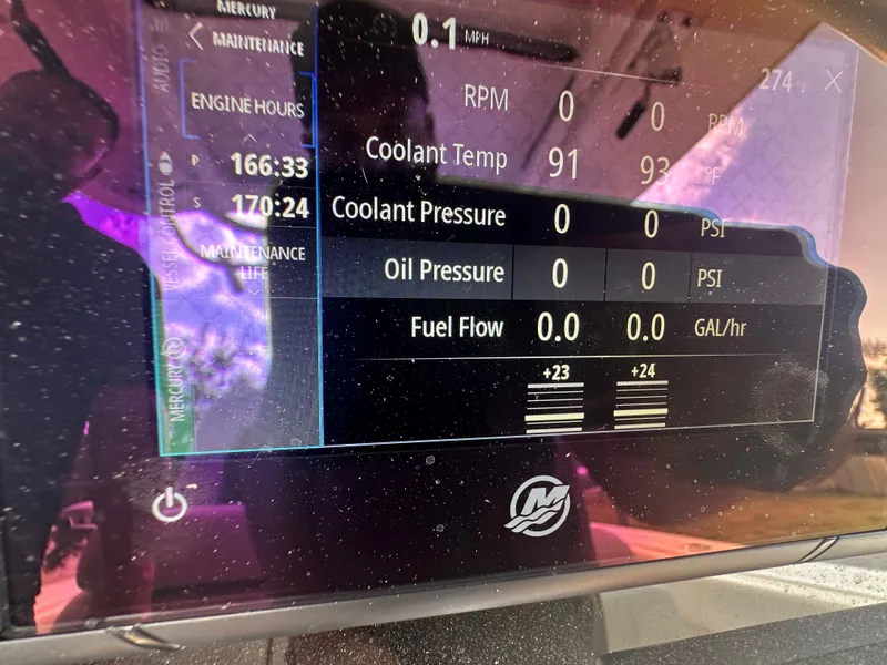 Slide: The Image of 2013 Boston Whaler 320 Outrage engine display with maintenance data. - 28