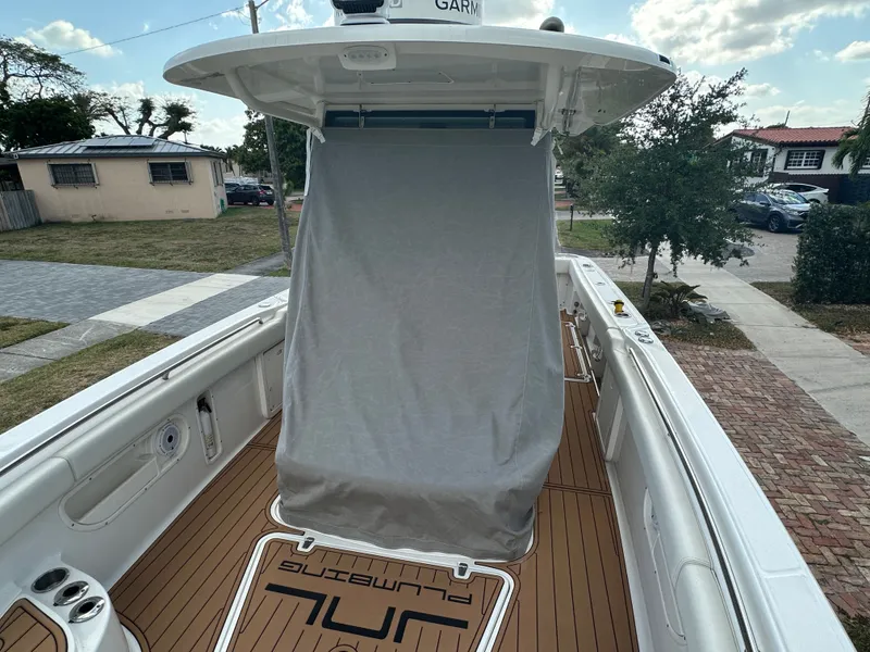 Slide: The Image of 2013 Boston Whaler 320 Outrage with cover outdoors. - 31