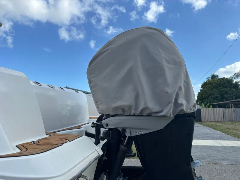 Slide: The Image of Boston Whaler 320 Outrage 2013 with covered outboard motor. - 35