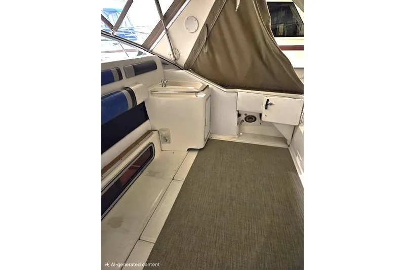 Slide: The Image of Interior of 1990 Sea Ray Sundancer 310 boat with seating and storage. - 7
