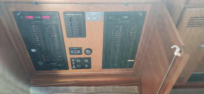 Slide: The Image of Electrical panel inside a 2004 Cabo 48 Convertible yacht. - 22