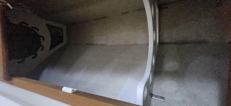 Slide: The Image of Interior storage space of a 2004 Cabo 48 Convertible boat. - 31